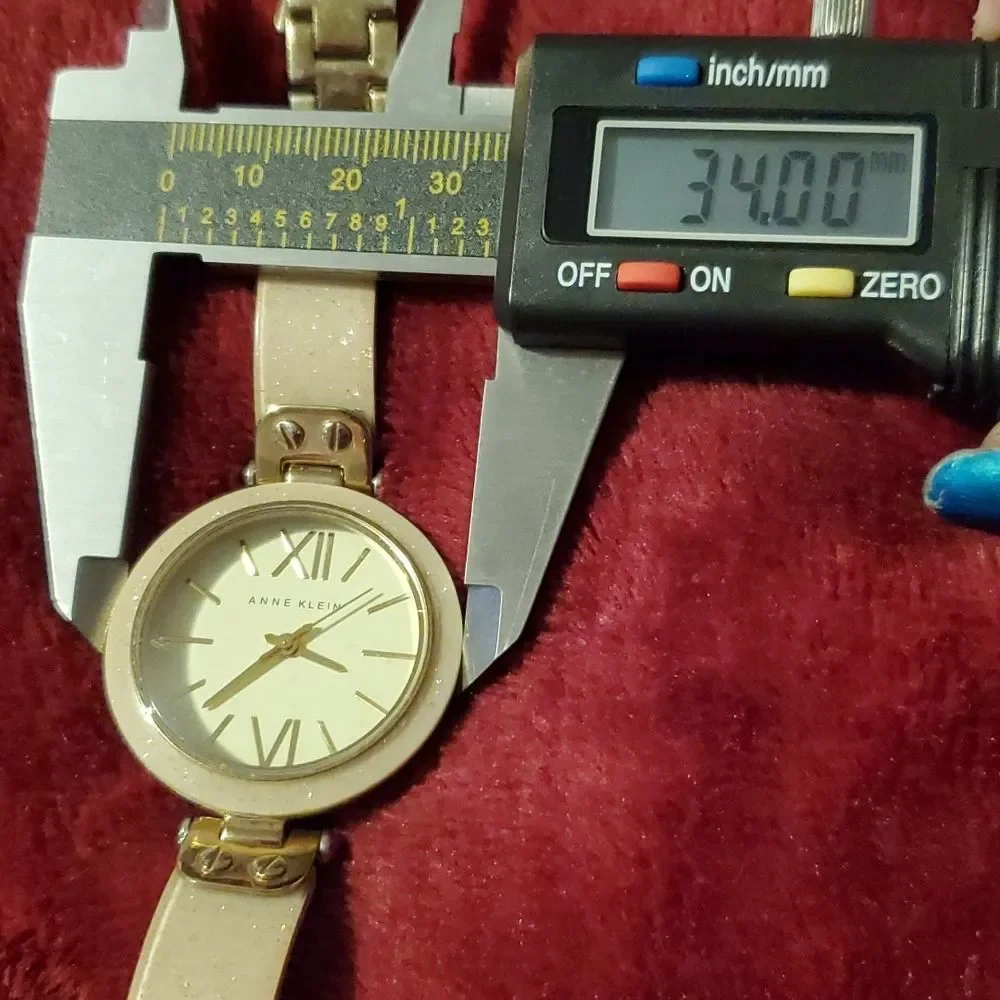 Anne Klein Women's AK-1408CRCR‎ Gold Plastic Analog Quartz Bangle Style Watch